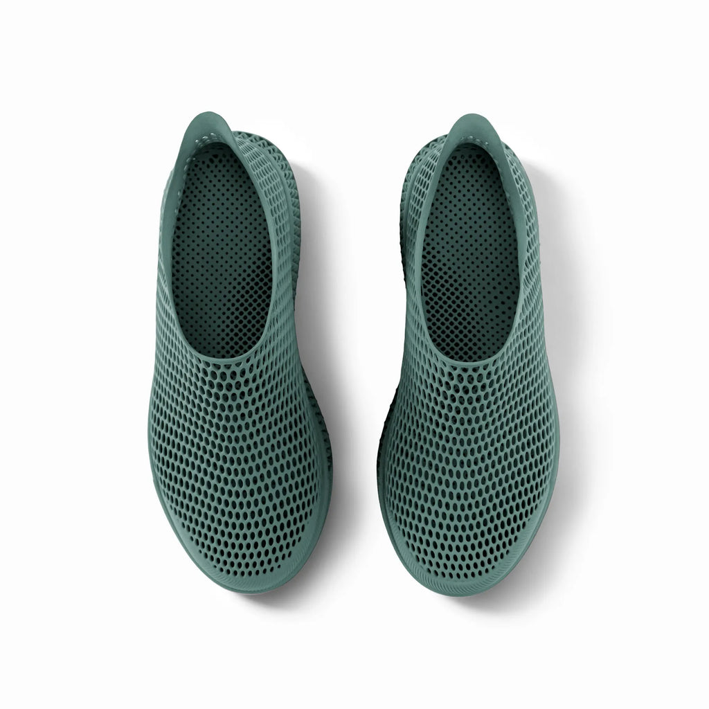 Pair of green 3D-printed casual sneakers, top view showing perforated mesh openings