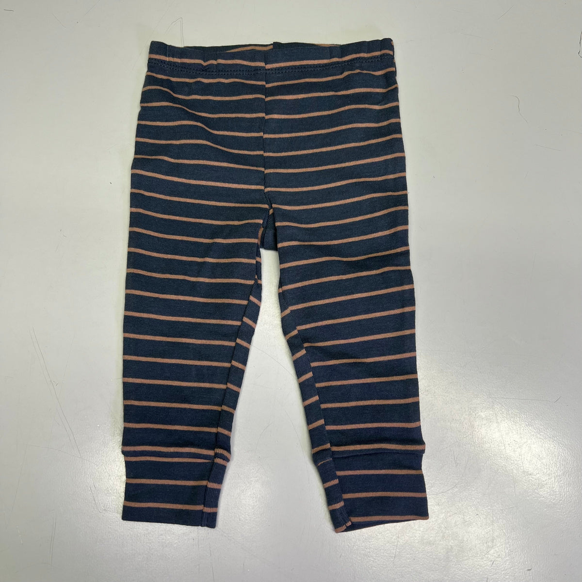 Baby boy striped pants in navy and tan with slim orange lines.