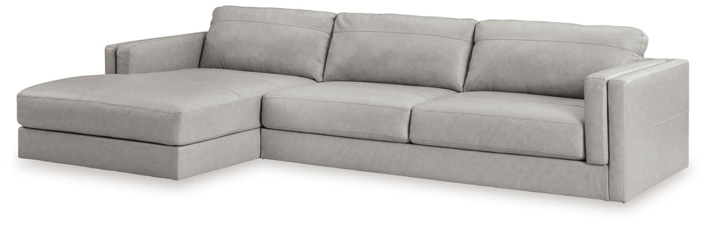 Light gray upholstered sectional sofa with corner chaise and wide armrests