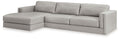 Light gray upholstered sectional sofa with corner chaise and wide armrests