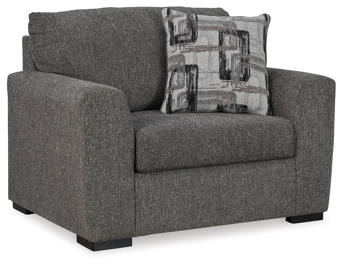 Pewter upholstered chair and a half with squared arms and patterned back pillow
