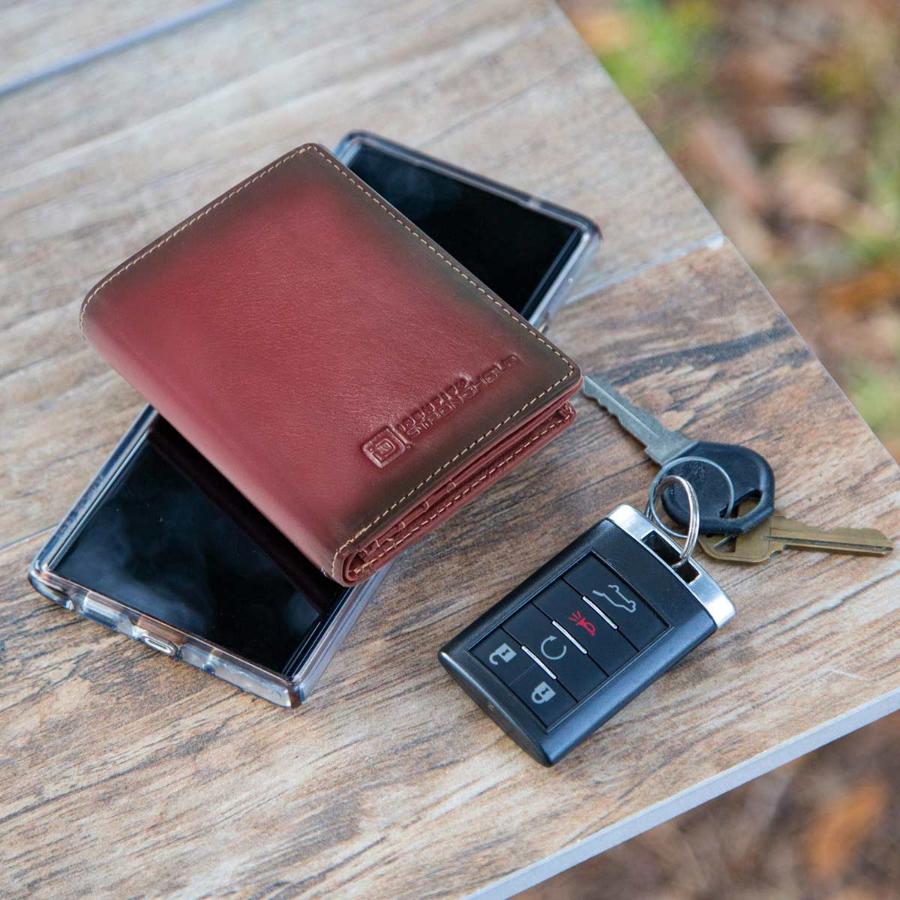 Brown leather minimalist wallet with embossed logo and open card compartment