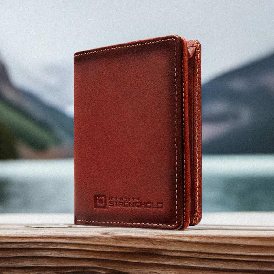 Brown minimalist leather wallet with stitched edges and embossed RFID logo