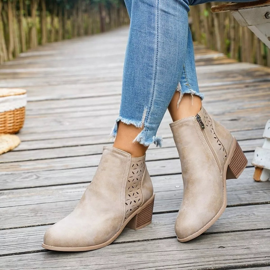 Beige ankle boots with block heel, side cutouts, and low-profile ankle shaft