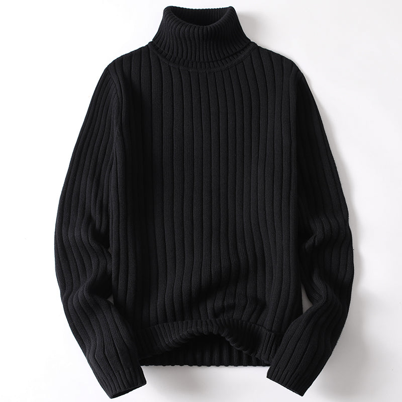 Black ribbed turtleneck sweater with long sleeves and ribbed hem.