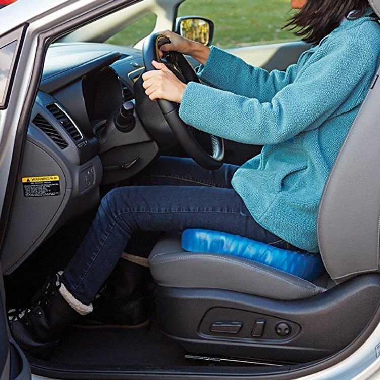 Light blue gel cushion on a car seat beside the driver