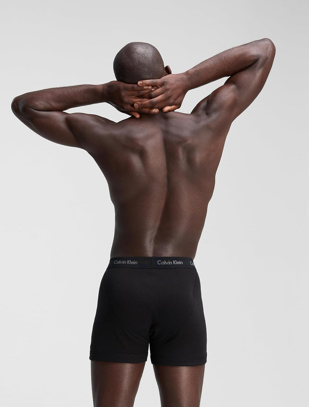 Men's black boxer briefs with Calvin Klein logo waistband, back upper view