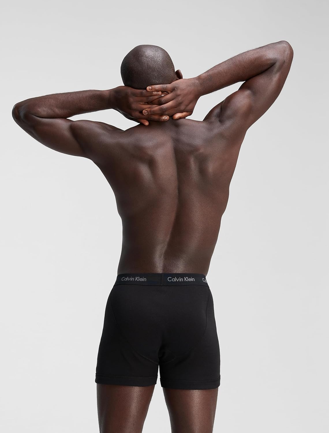 Men's black boxer briefs with Calvin Klein logo waistband, back upper view