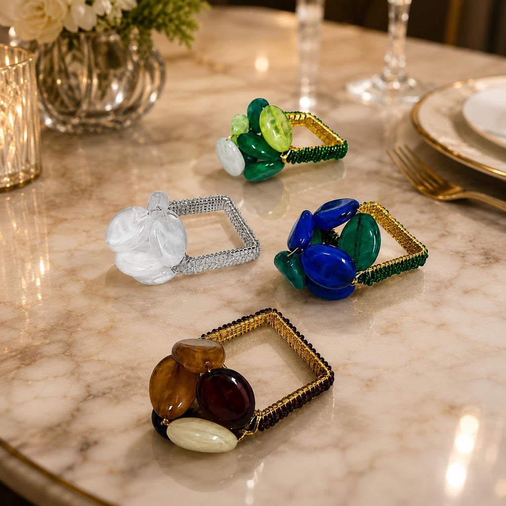 Set of 4 multicolor gemstone beaded napkin rings on a dining table