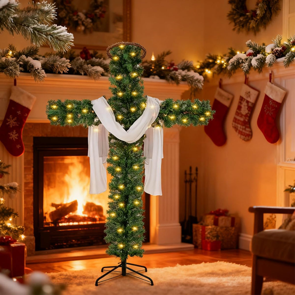 Pre-lit cross-shaped artificial pine tree with white drapes and glowing warm lights