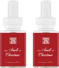 Pair of red “the Smell of Christmas” fragrance refill bottles with white ribbed caps