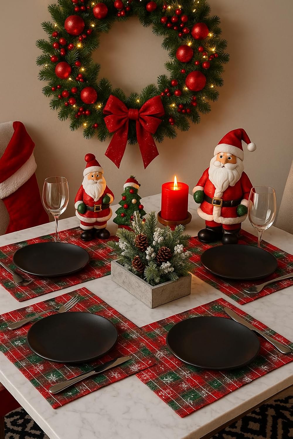 Four red and green tartan plaid placemats with snowflake pattern on a holiday table