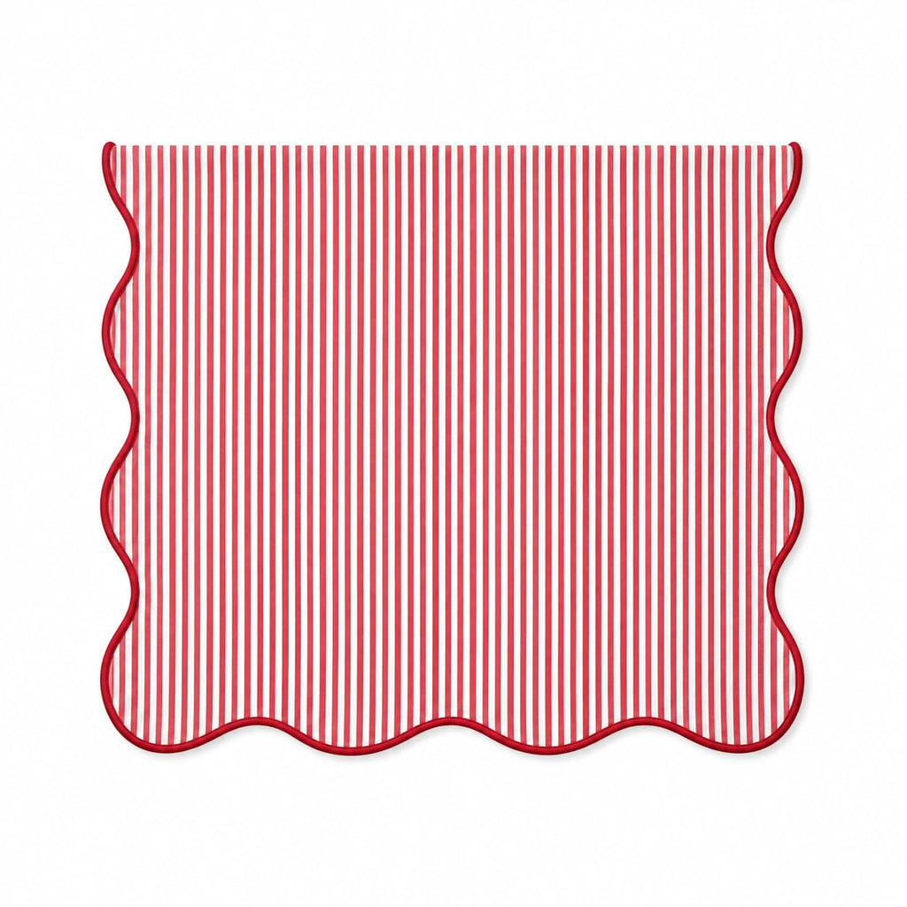 Red and white striped table runner with scalloped edges, lined