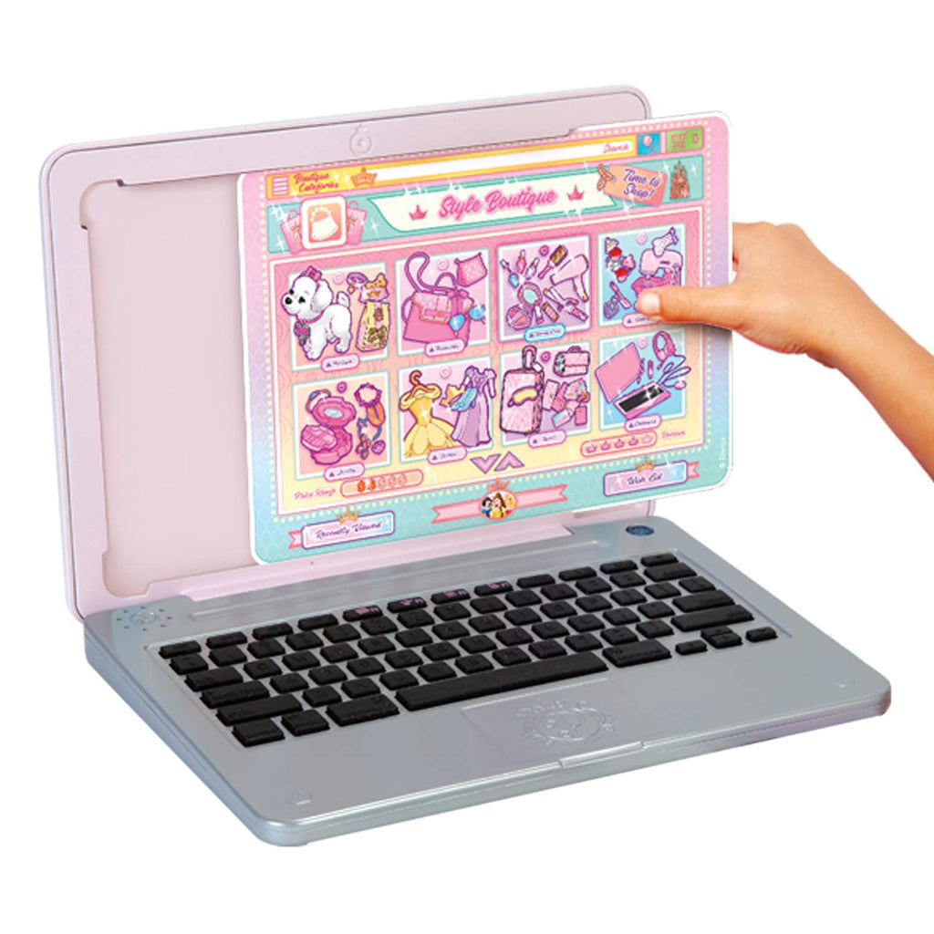 Pink kids laptop with open screen showing princess stickers and a black keyboard