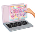 Pink kids laptop with open screen showing princess stickers and a black keyboard