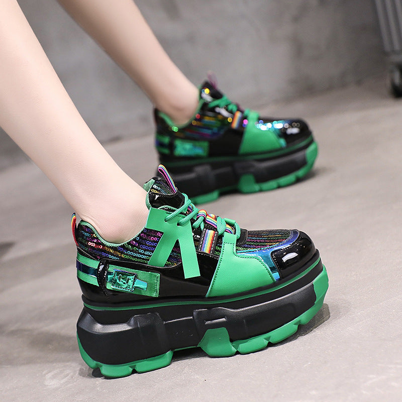 Green lace-up chunky sneakers with multicolor lace detailing and glossy black toe panel