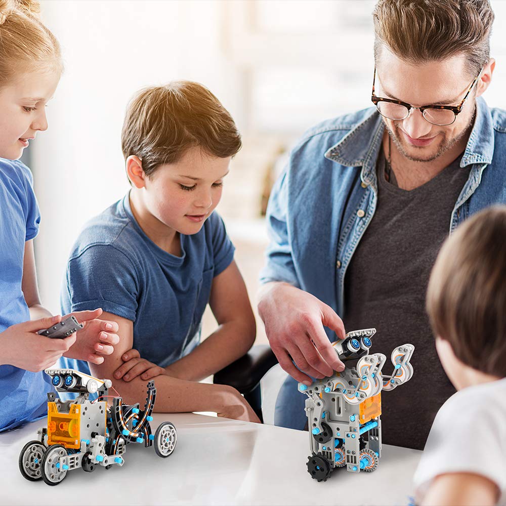 Teacher and children assembling solar-powered robot kit robots together