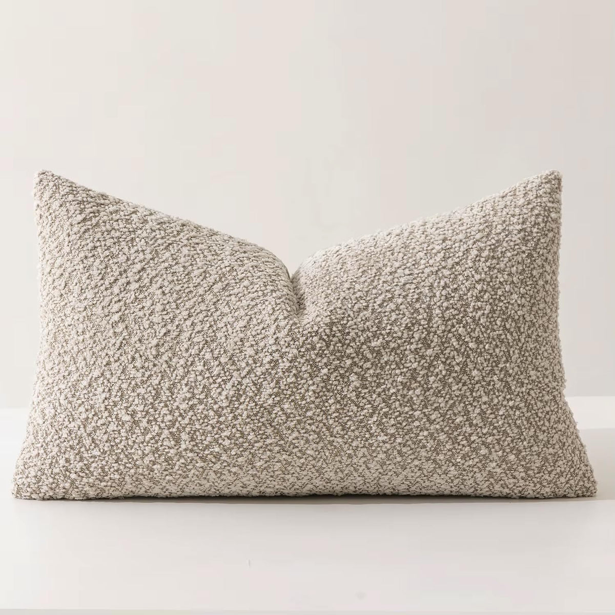 Textured bouclé-style lumbar throw pillow in beige