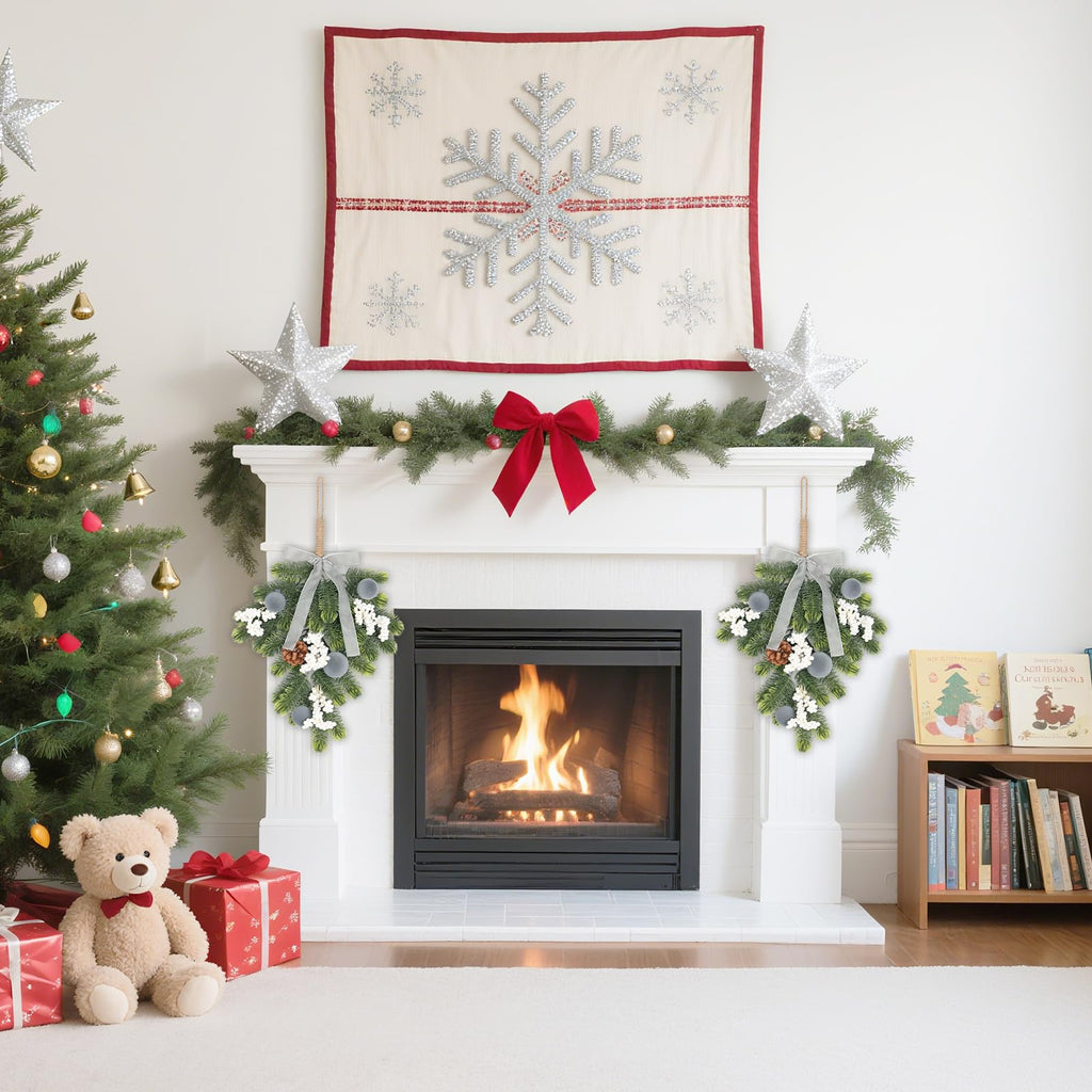 Holiday fireplace mantel with garland and winter-themed decorations above a lit firebox