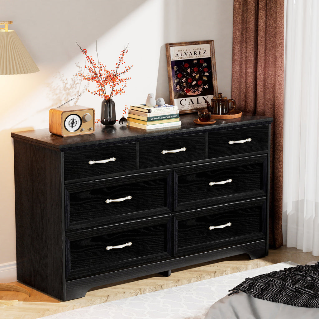 Black dresser chest with multiple drawers and chrome metal bar pull handles