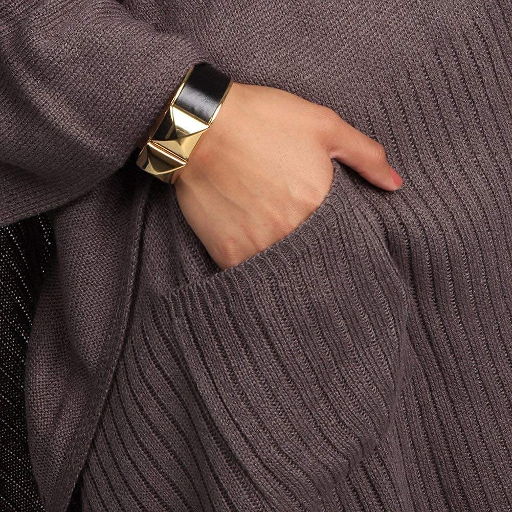 Ribbed knitted poncho edge and pocket opening detail in slate gray