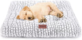 Light gray quilted crate bed with a tan puppy lying on it