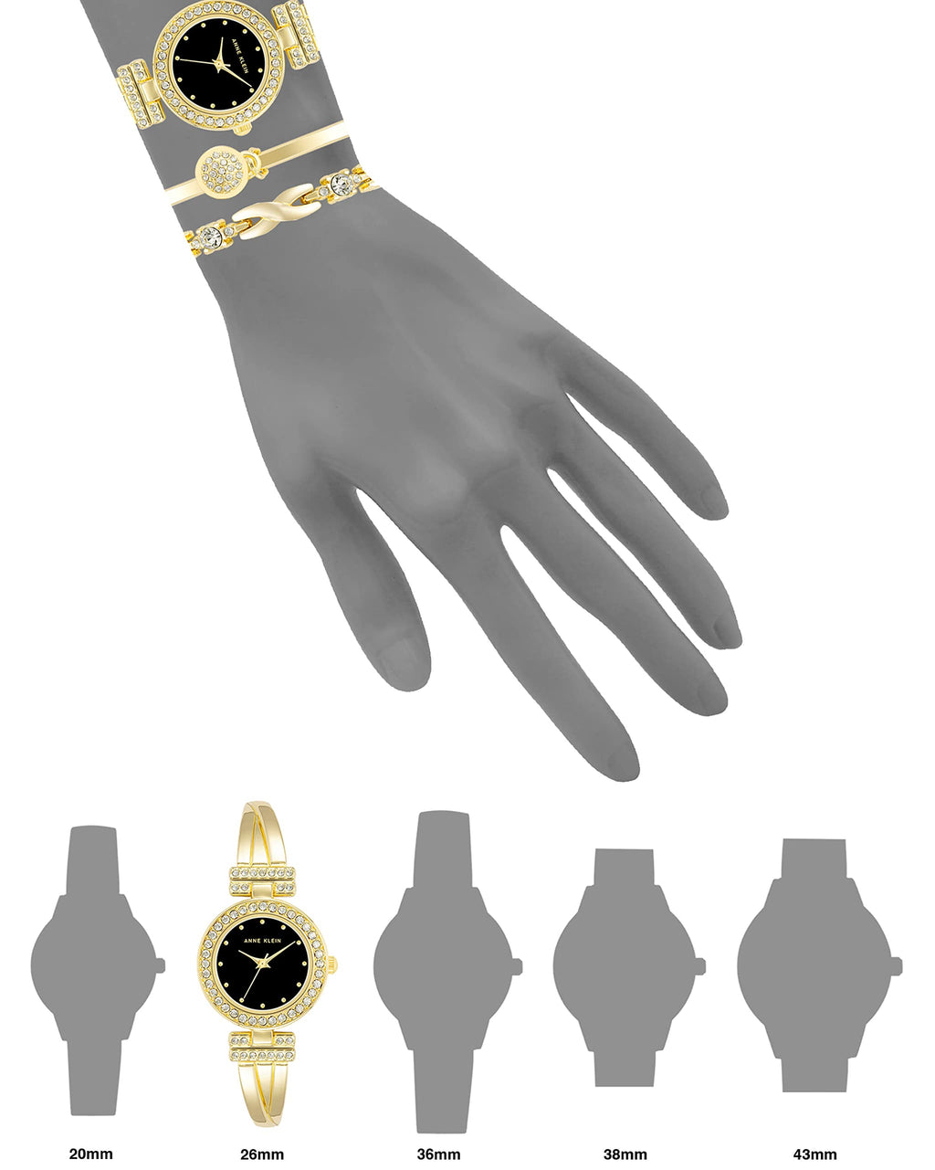Black-dial bangle watch with gold-tone crystal bezel and matching bracelet cuffs