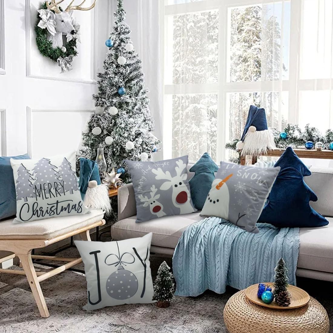 Set of Christmas throw pillow covers on sofa with snowman, reindeer, ornament, tree prints
