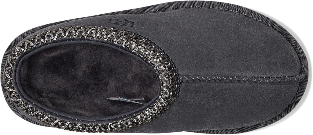 Kids' UGG Tasman II slipper, side view showing fuzzy lining and woven edge