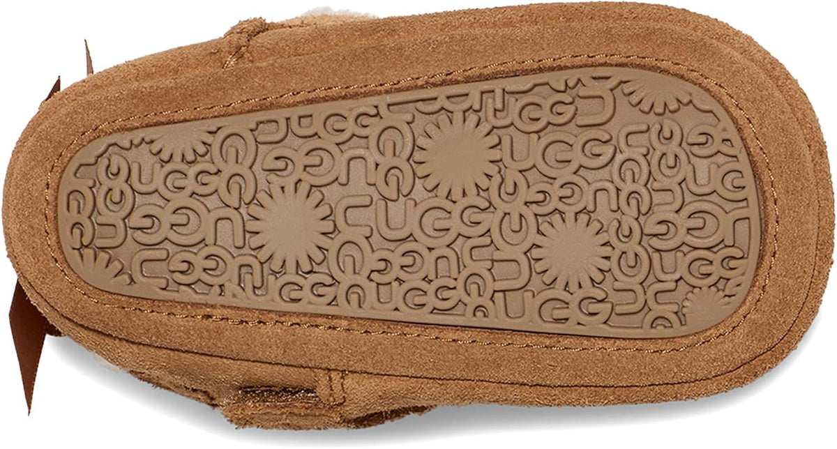 UGG baby Bailey bow boots chestnut suede with patterned rubber outsole, heel view