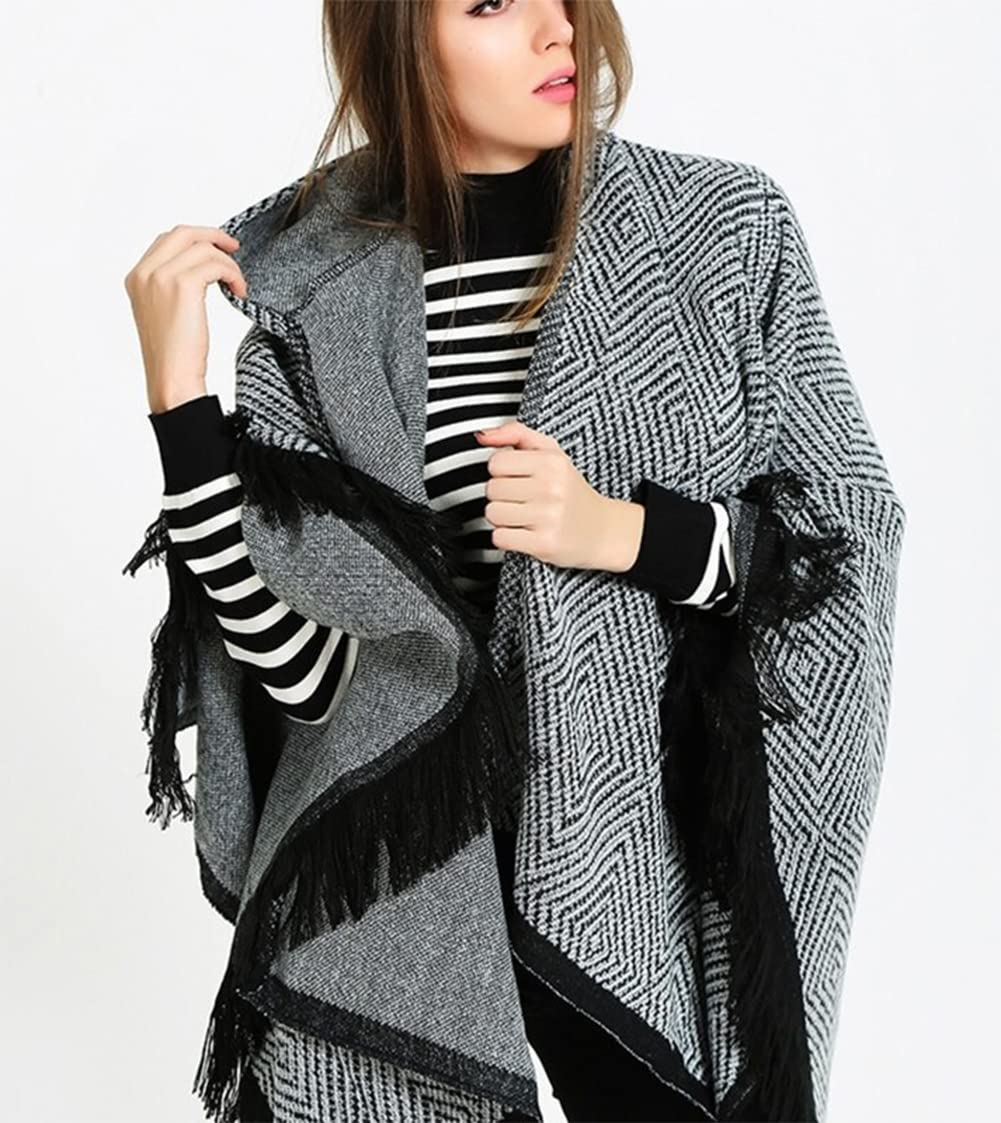 Women’s oversized hooded poncho cape with geometric knit texture and black fringe edging