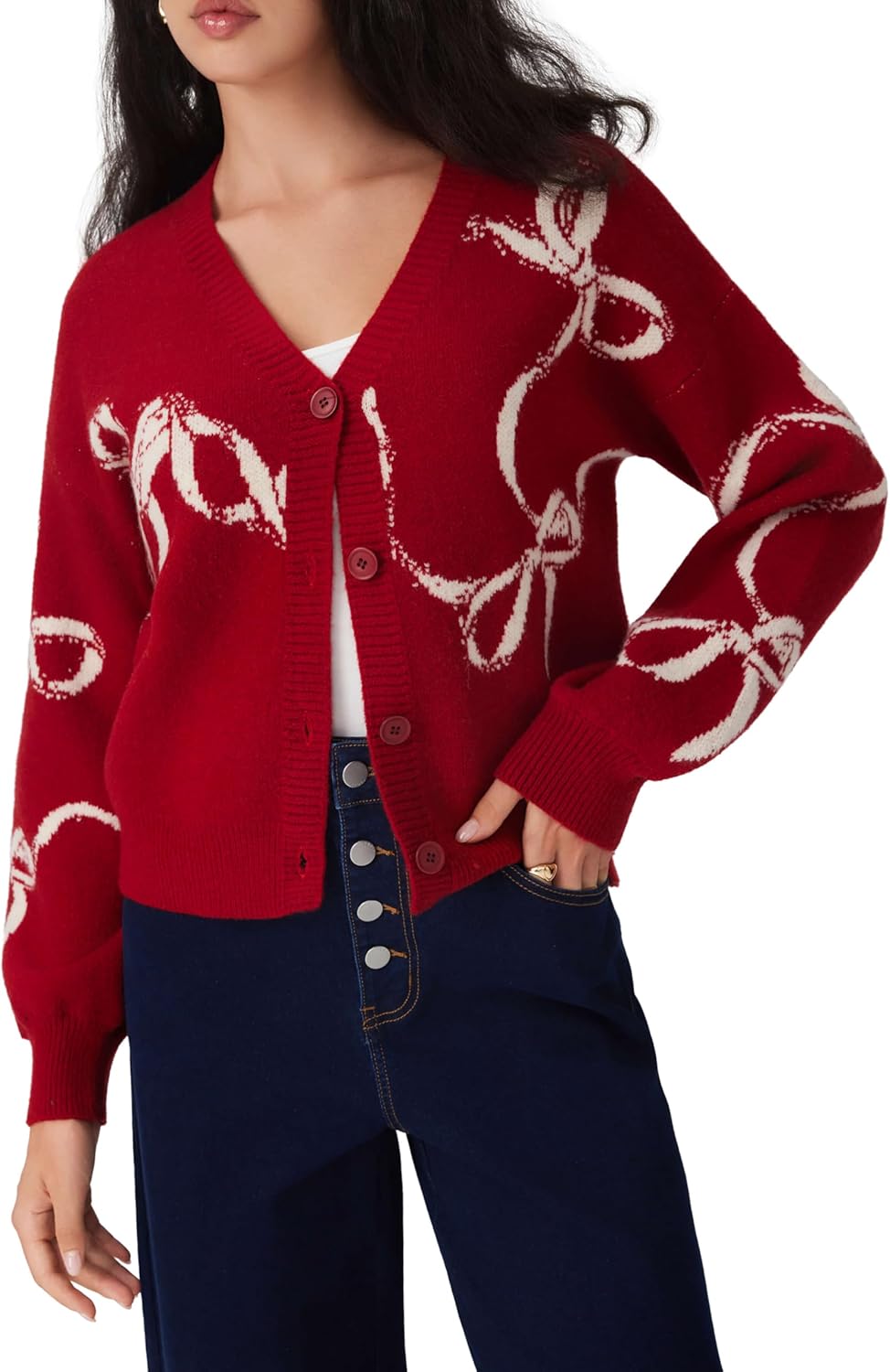 Women’s red knit cardigan with white bow print, long sleeves, V-neck button front