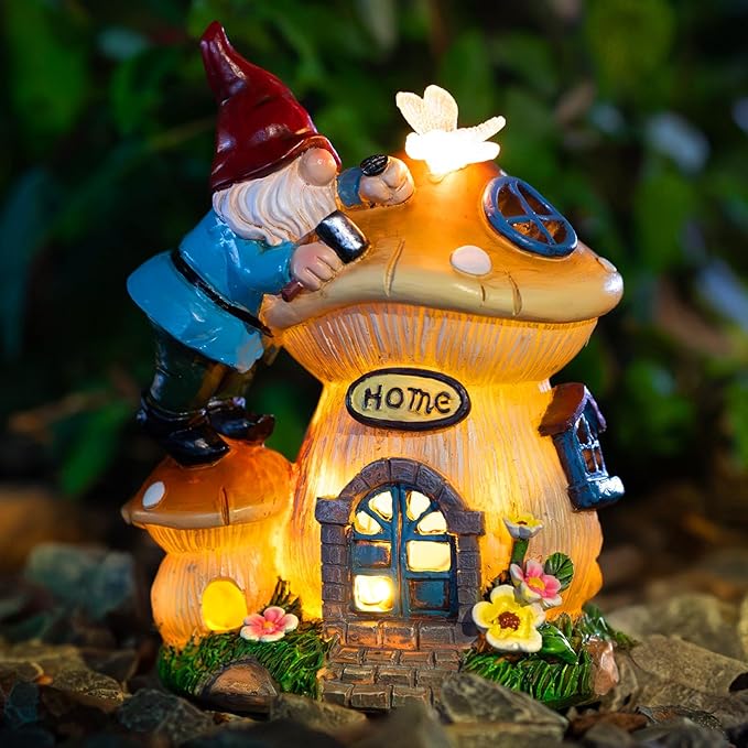 Solar gnome lantern statue with glowing house and mushroom cap, blue overalls