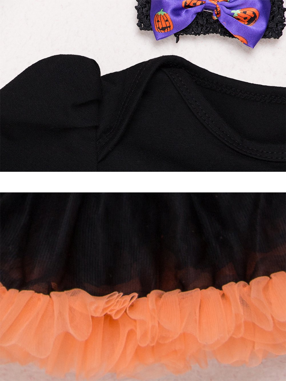 Infant black romper with orange tulle ruffle hem; Halloween bow headband visible