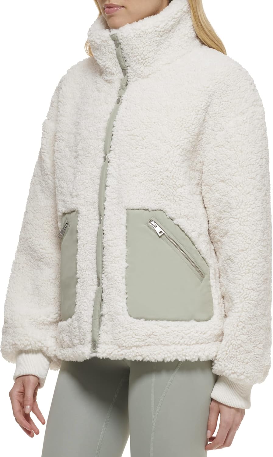 Cream sherpa teddy jacket close-up with snap front and two zip chest pockets