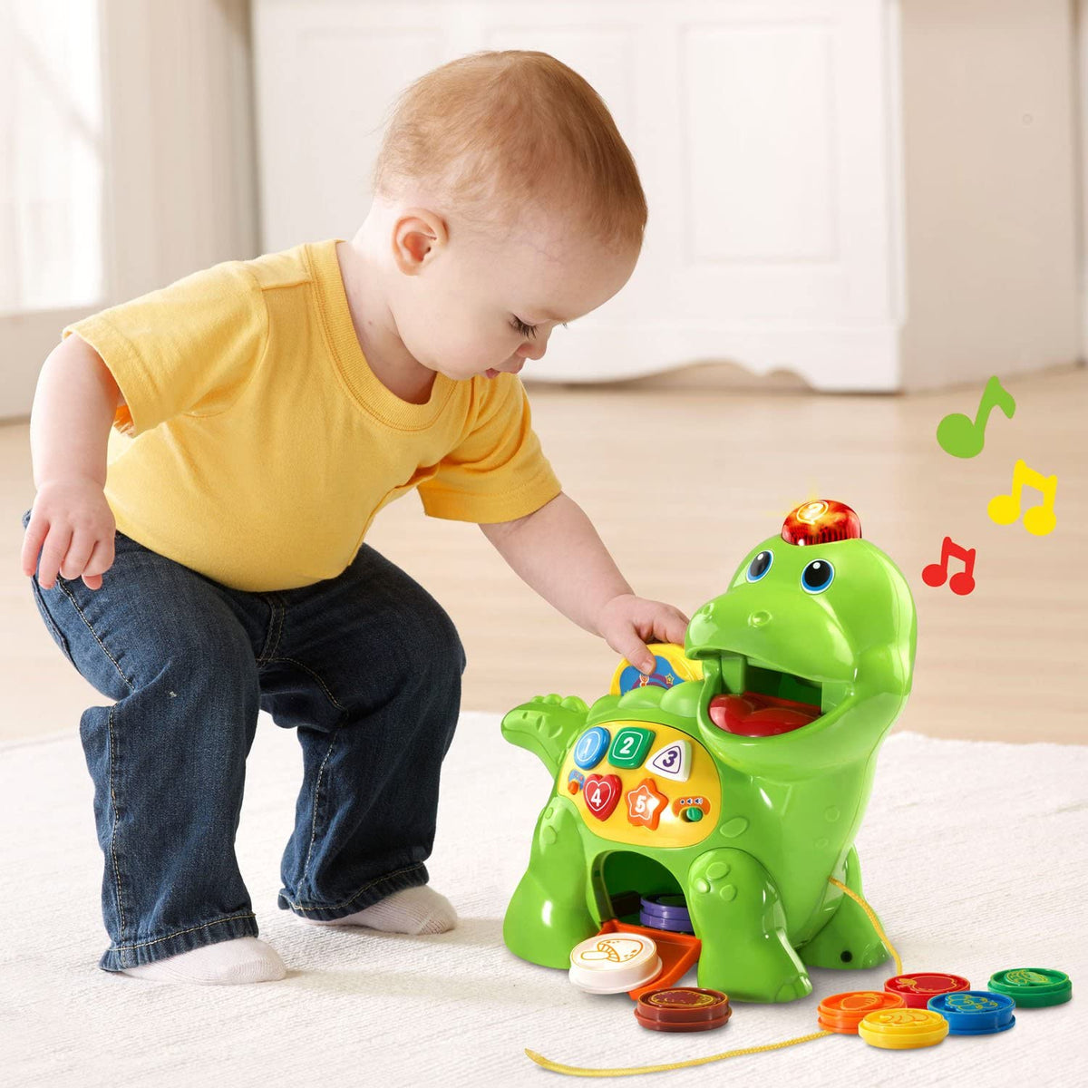 Green dinosaur counting toy with open mouth and number panel, with plastic food disks