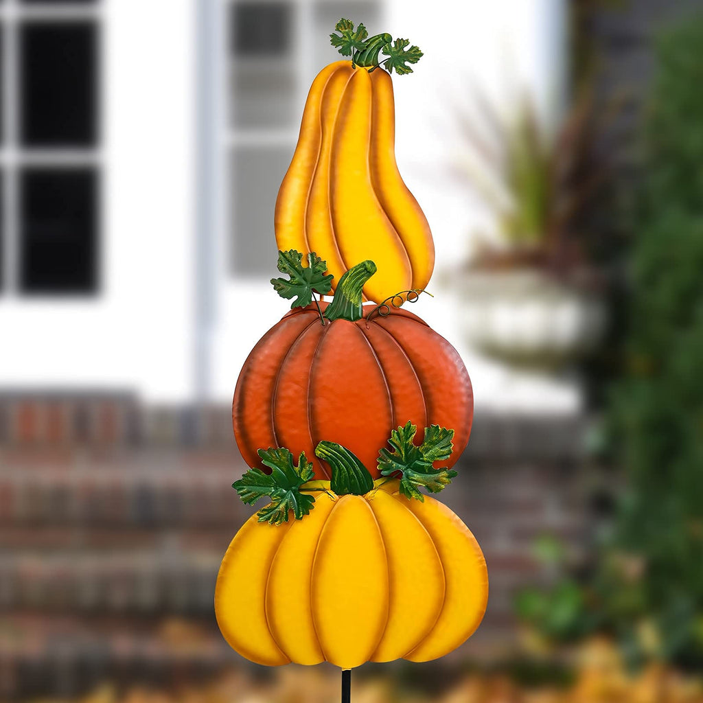 Stacked pumpkin yard stake with yellow top gourd, orange pumpkin, and green leaf stem accents