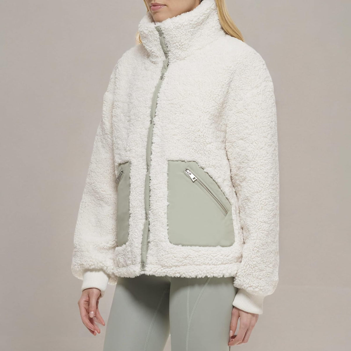 Cream sherpa teddy jacket with snap front and zip chest pockets in sea green