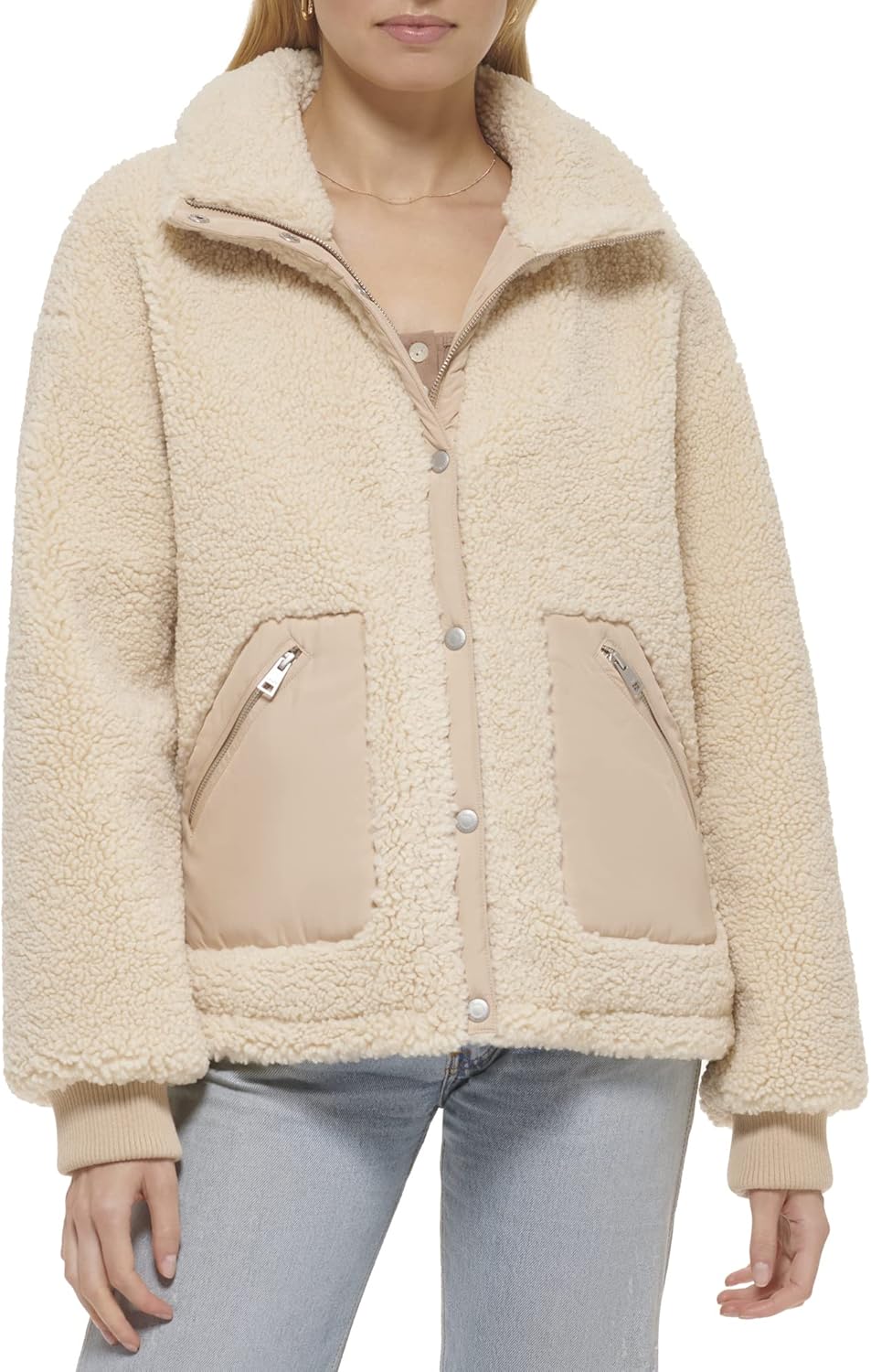 Beige sherpa teddy jacket with snap front, stand collar, and two zip chest pockets