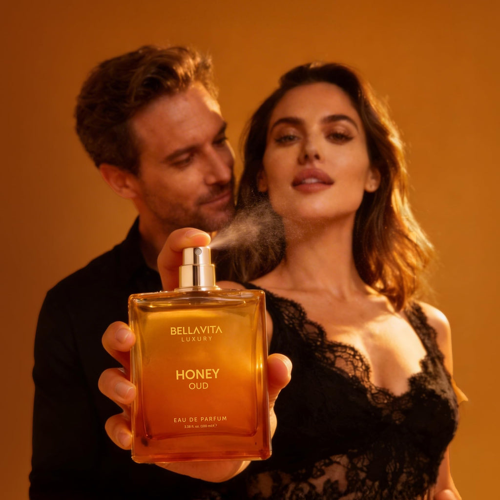 Fragrance bottle held by hands, amber bottle with gold cap