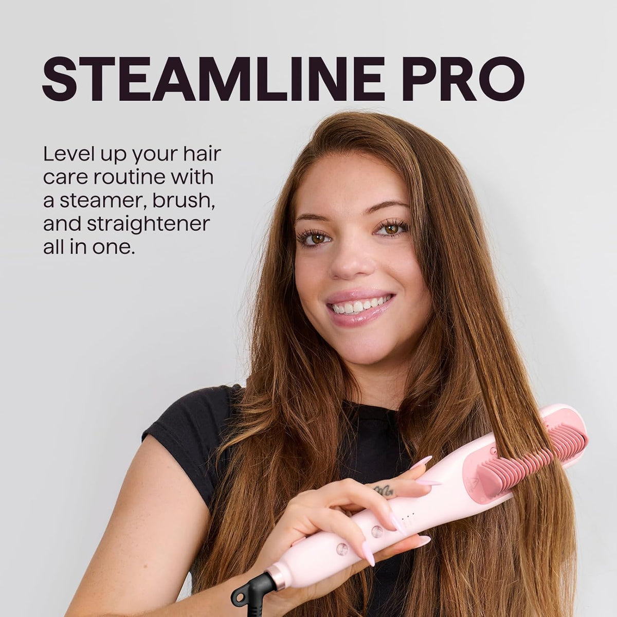 Pink steam hair straightening brush styling long hair