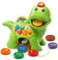 Green counting dinosaur toy with number buttons, light dome top, and molded food pieces