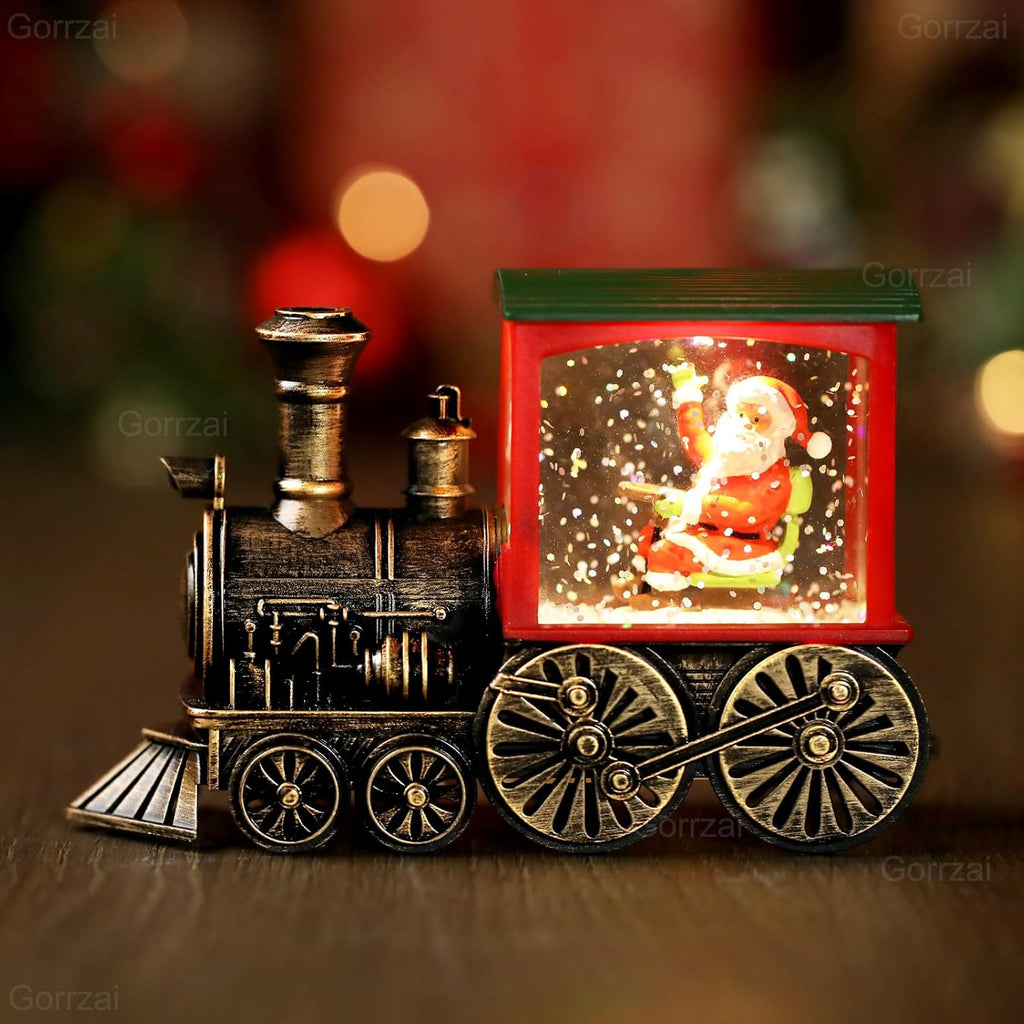 Front close-up of red train snow globe lantern with Santa scene and glittering window