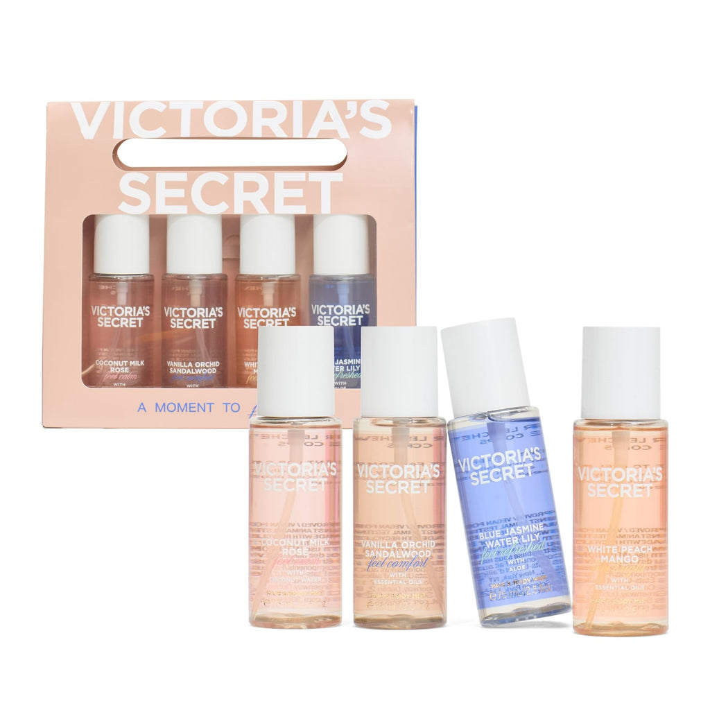 Four mini fragrance mist bottles with assorted caps and a display box.