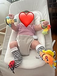 Baby rattle socks and wrist rattles set, striped socks and wrist toy rattles in hands