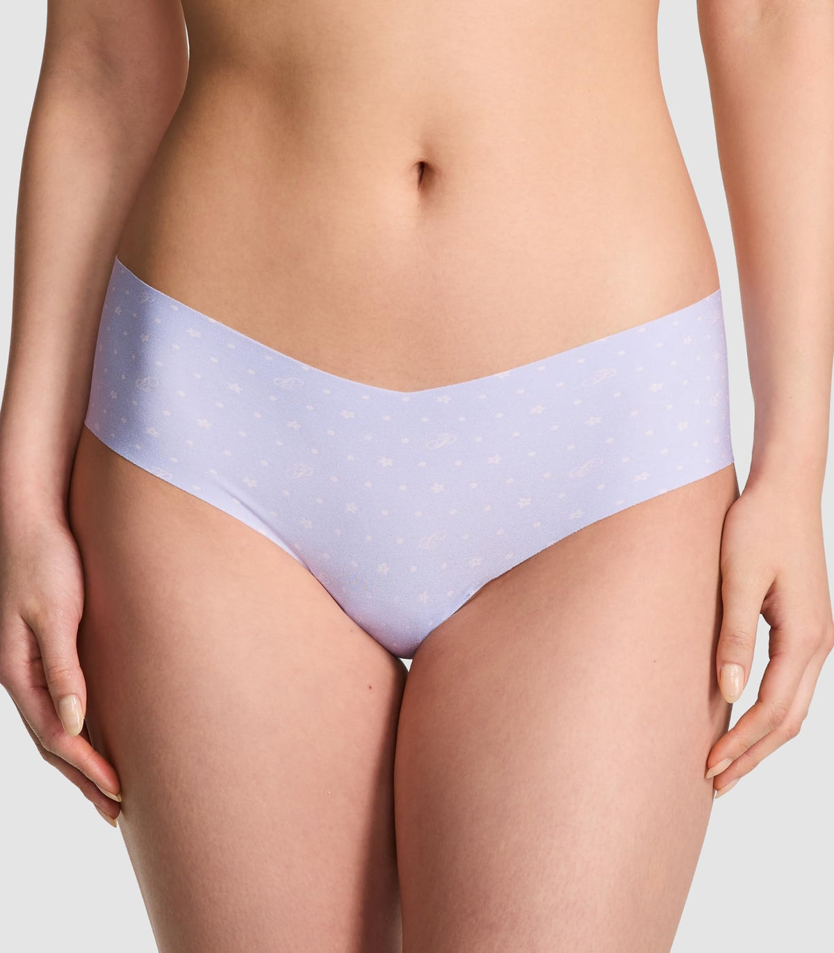 Light purple no-show cheeky panties with allover micro pattern on model