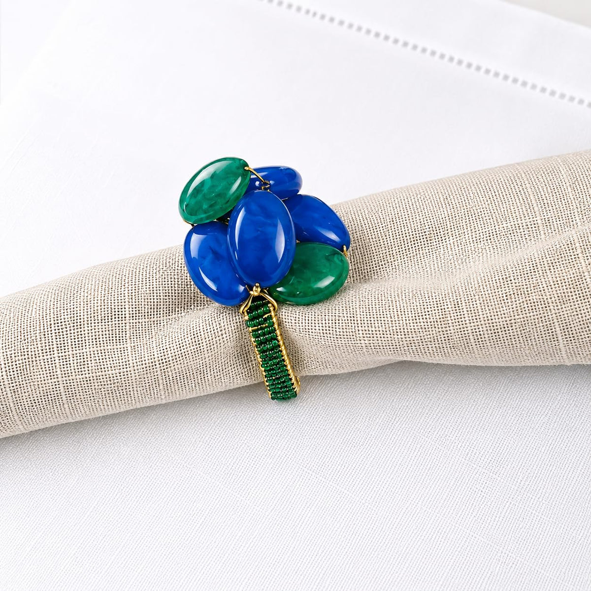 Blue and green oval gemstone beaded napkin ring with textured green band