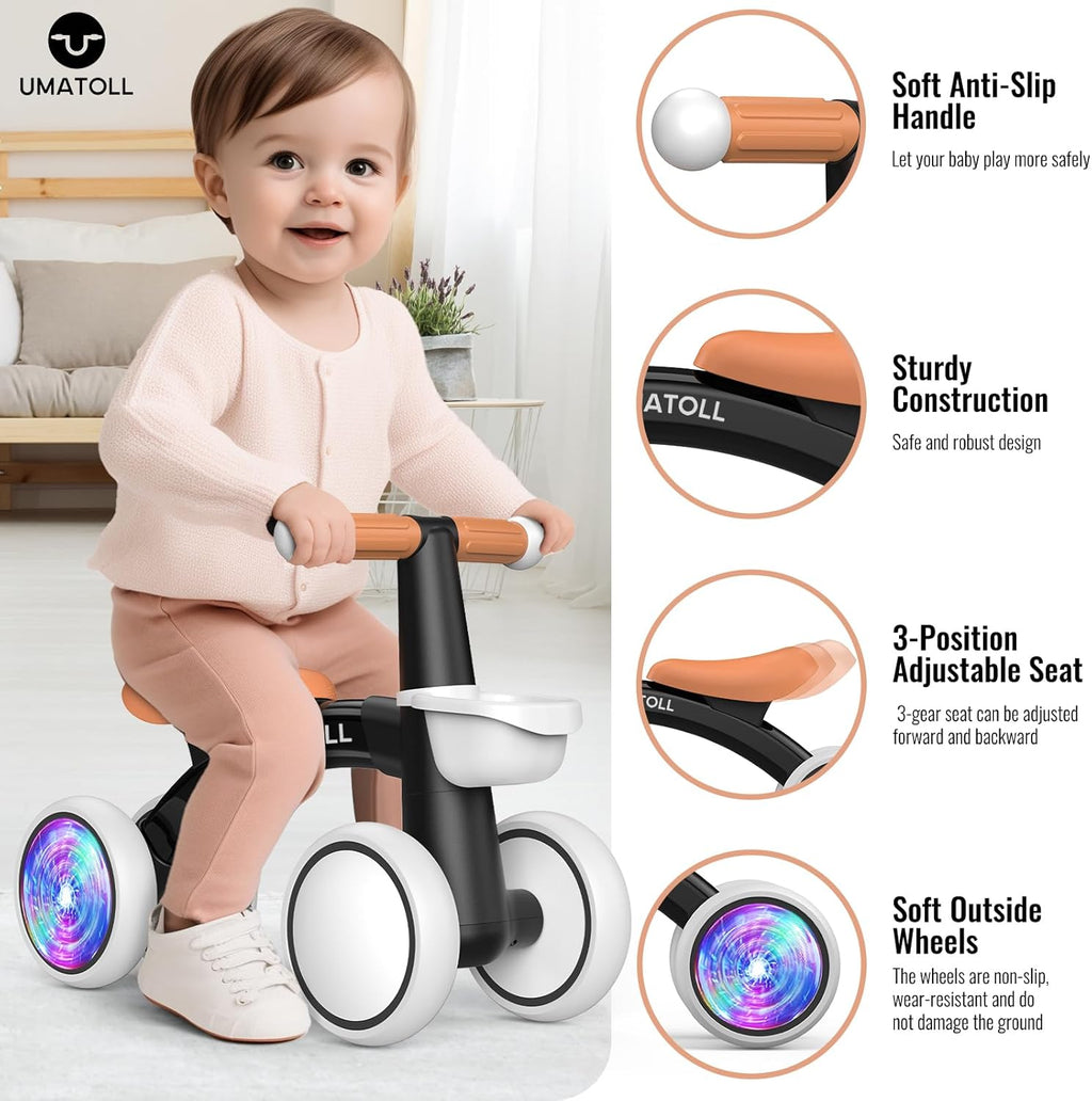 Toddler using a black and orange balance bike with white seat and glowing wheels