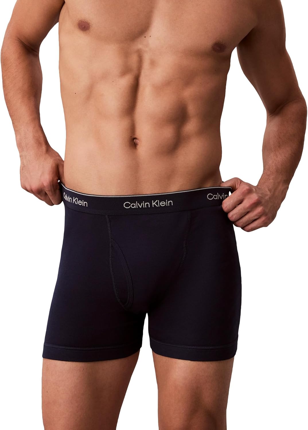 Calvin Klein men’s cotton boxer briefs in dark navy/black on model, fitted trunk style