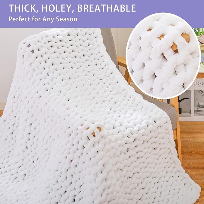 White chunky crochet throw blanket with thick rope-knot texture, close-up view